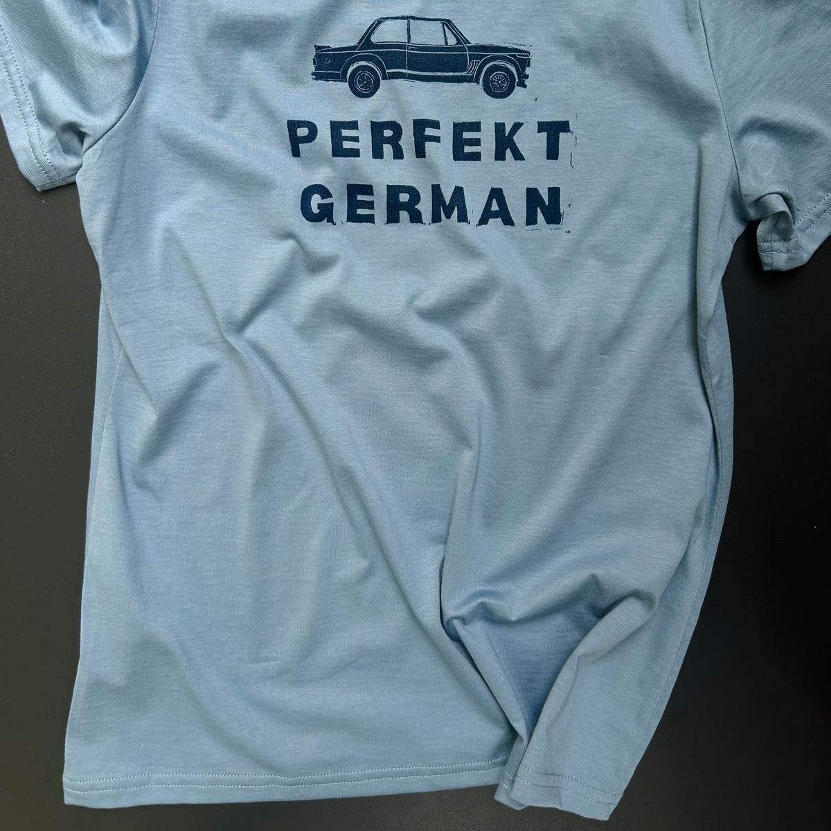 Woman’s blue PERFEKT GERMAN 2002 t-shirt