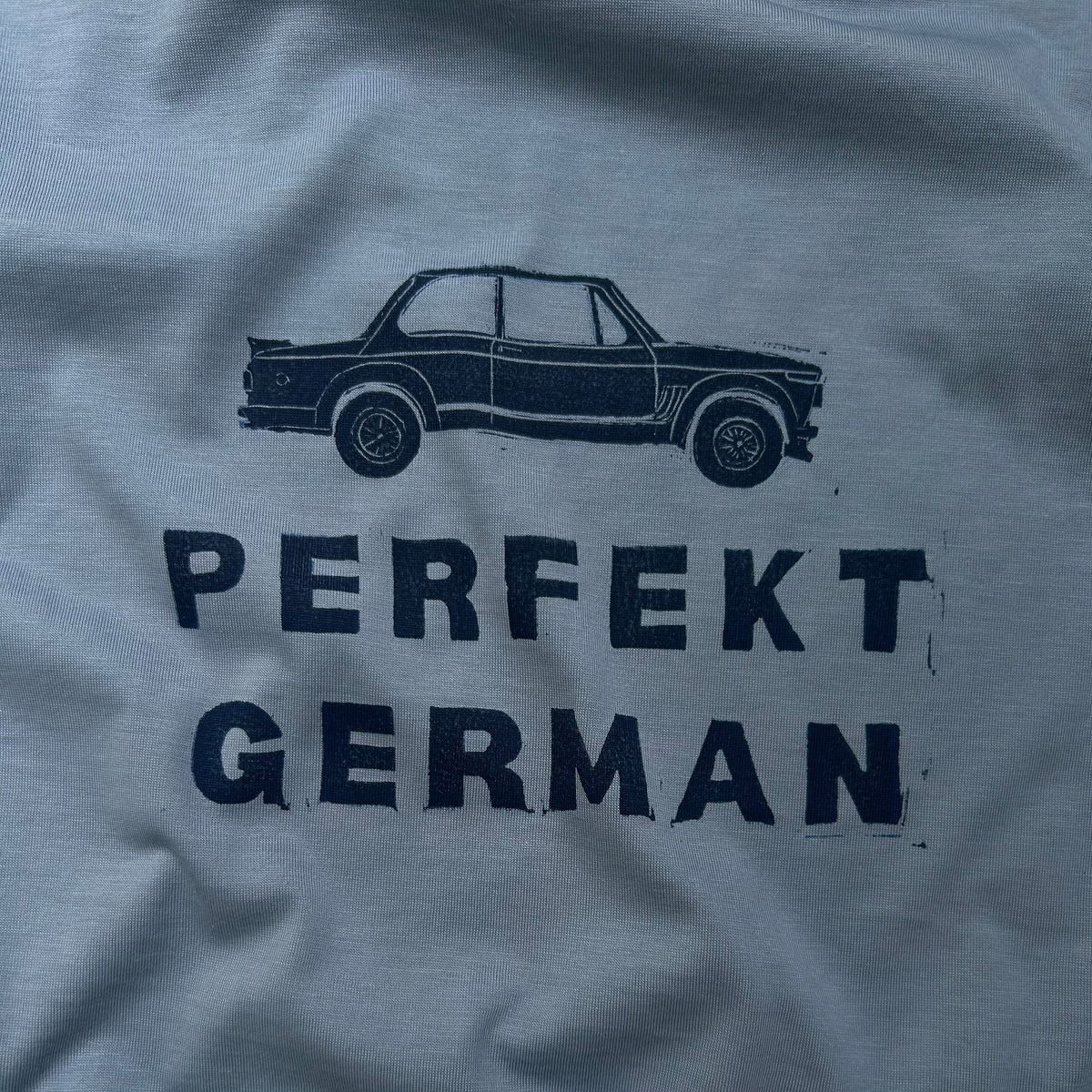 Woman’s blue PERFEKT GERMAN 2002 t-shirt